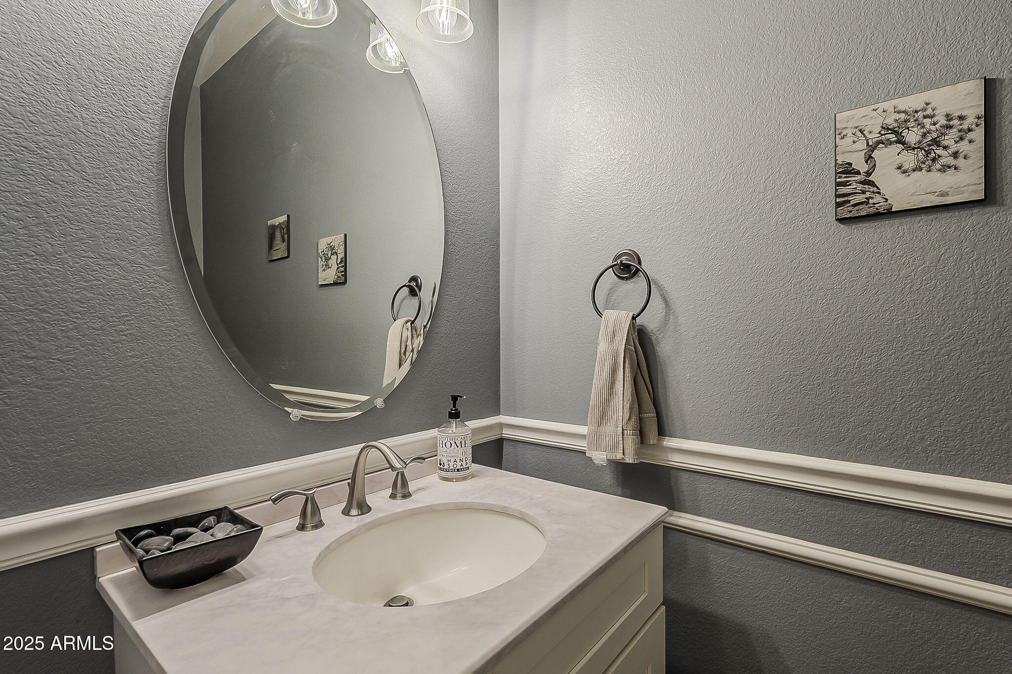 4407 West Crescent Road San Tan Valley, AZ 85144 - Photo 19 of 50 a bathroom with a sink and a mirror