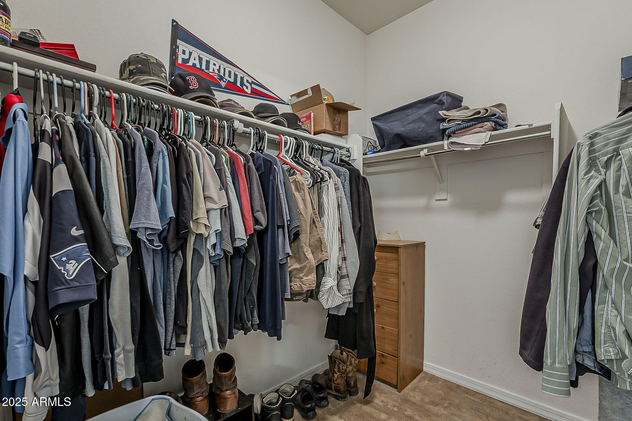 4407 West Crescent Road San Tan Valley, AZ 85144 - Photo 28 of 50 a view of walk in closet with clothes and shoes