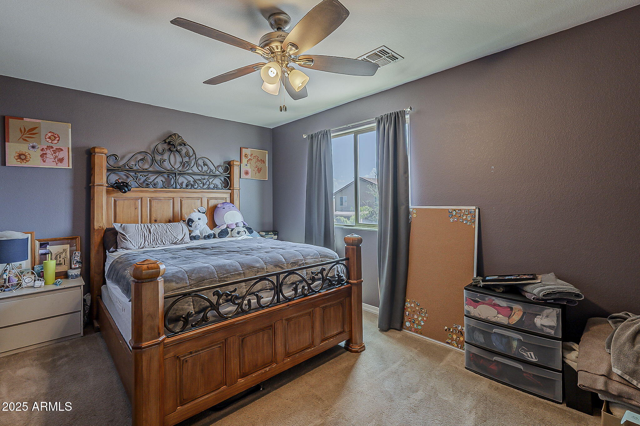 4407 West Crescent Road San Tan Valley, AZ 85144 - Photo 35 of 50 a bedroom with a bed and a chandelier