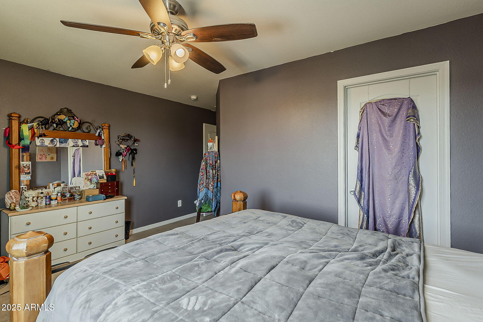 4407 West Crescent Road San Tan Valley, AZ 85144 - Photo 36 of 50 a bedroom with a bed and a chandelier