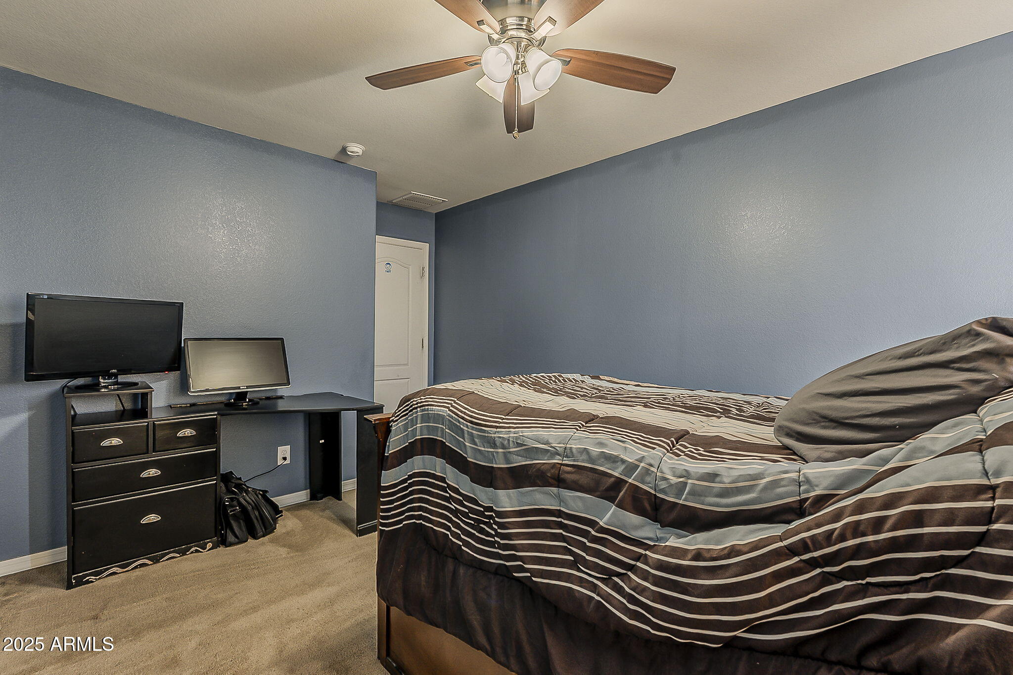 4407 West Crescent Road San Tan Valley, AZ 85144 - Photo 39 of 50 a bedroom with a bed and a flat screen tv