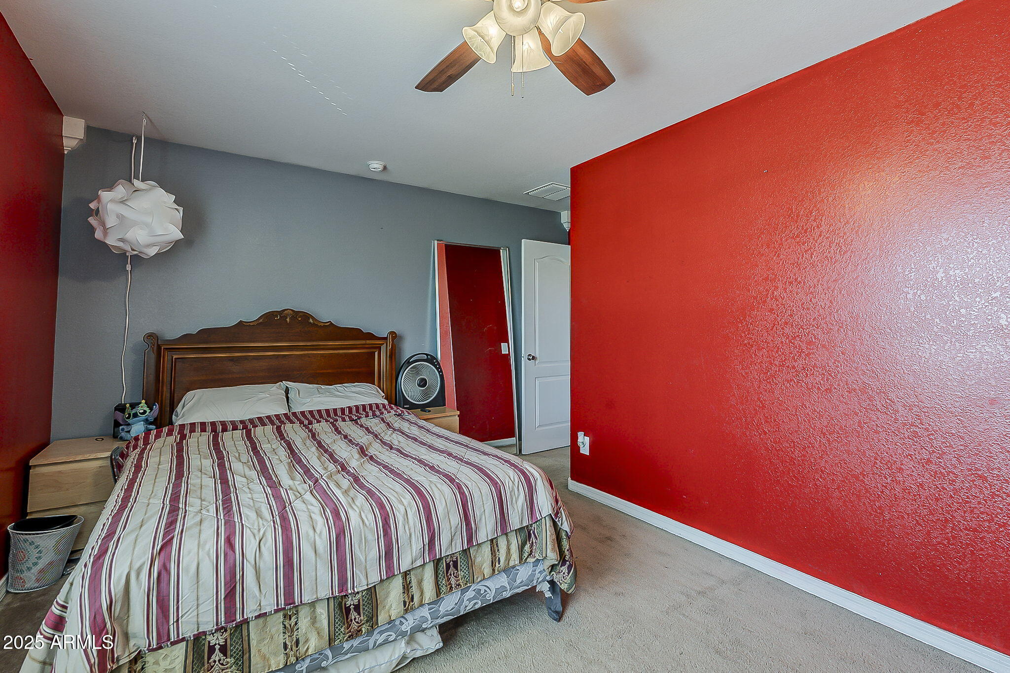 4407 West Crescent Road San Tan Valley, AZ 85144 - Photo 41 of 50 a bedroom with a bed and a chandelier