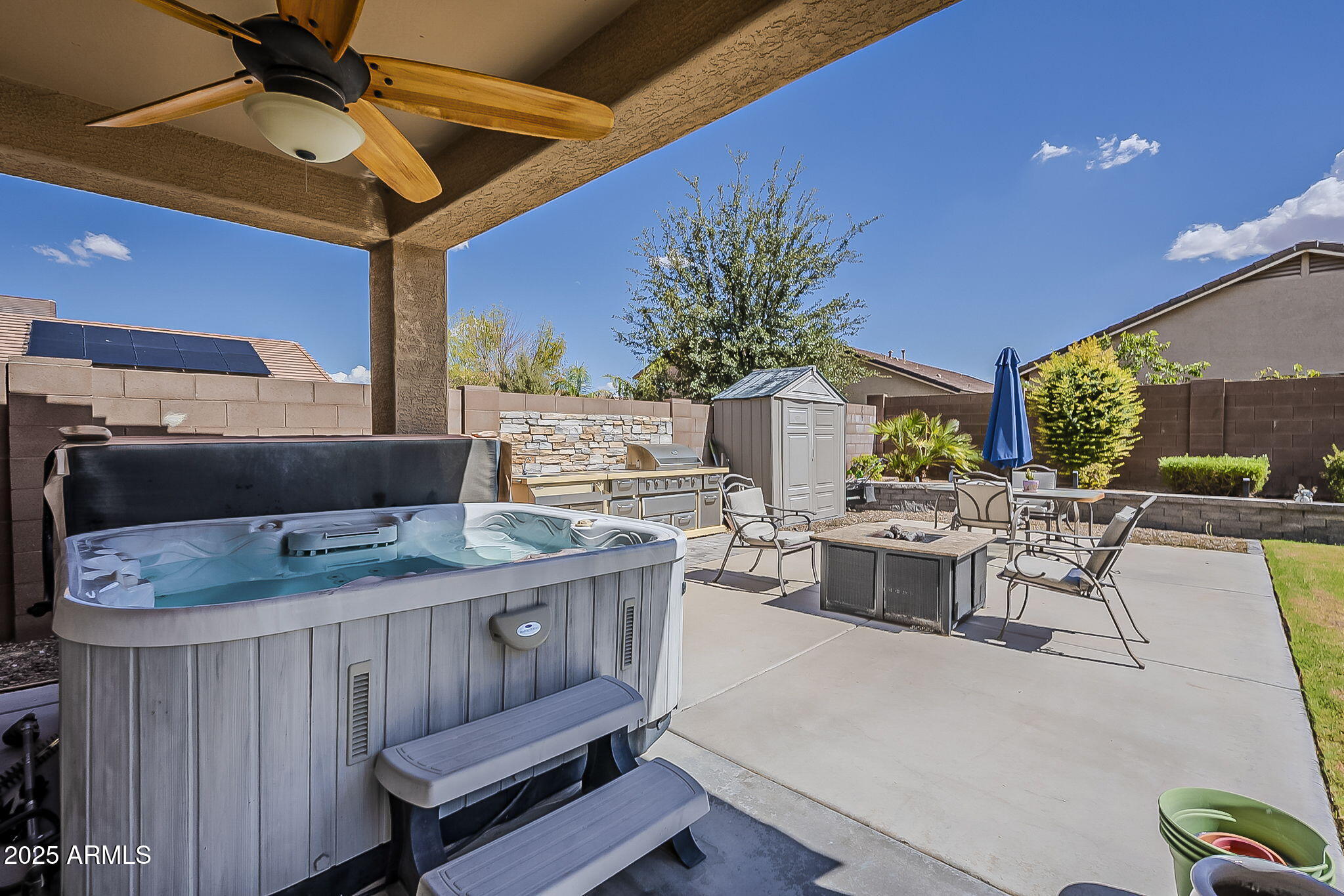 4407 West Crescent Road San Tan Valley, AZ 85144 - Photo 43 of 50 a view of an outdoor dining space with a table and chairs