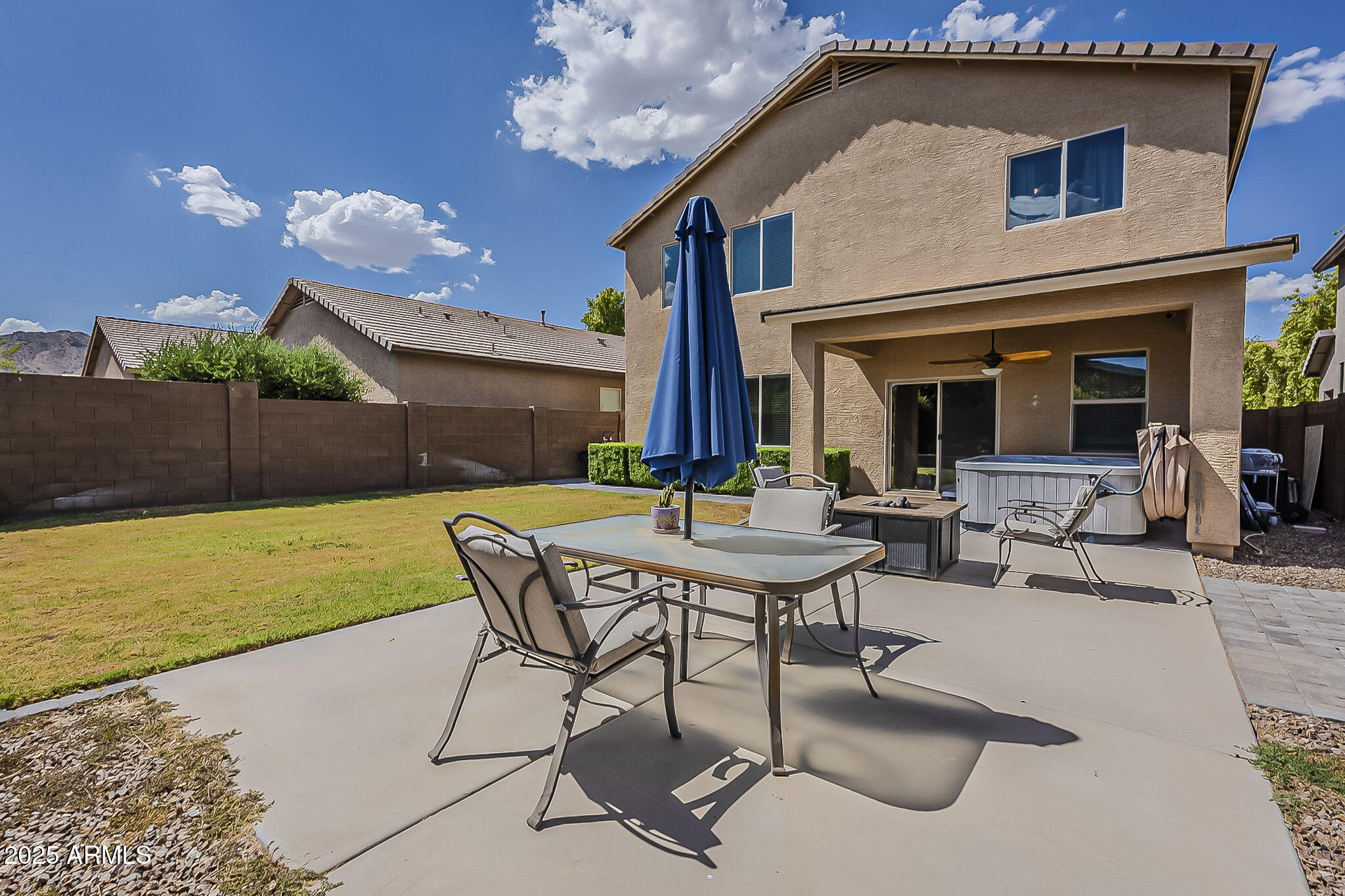 4407 West Crescent Road San Tan Valley, AZ 85144 - Photo 47 of 50 a view of a patio with table and chairs with potted plants