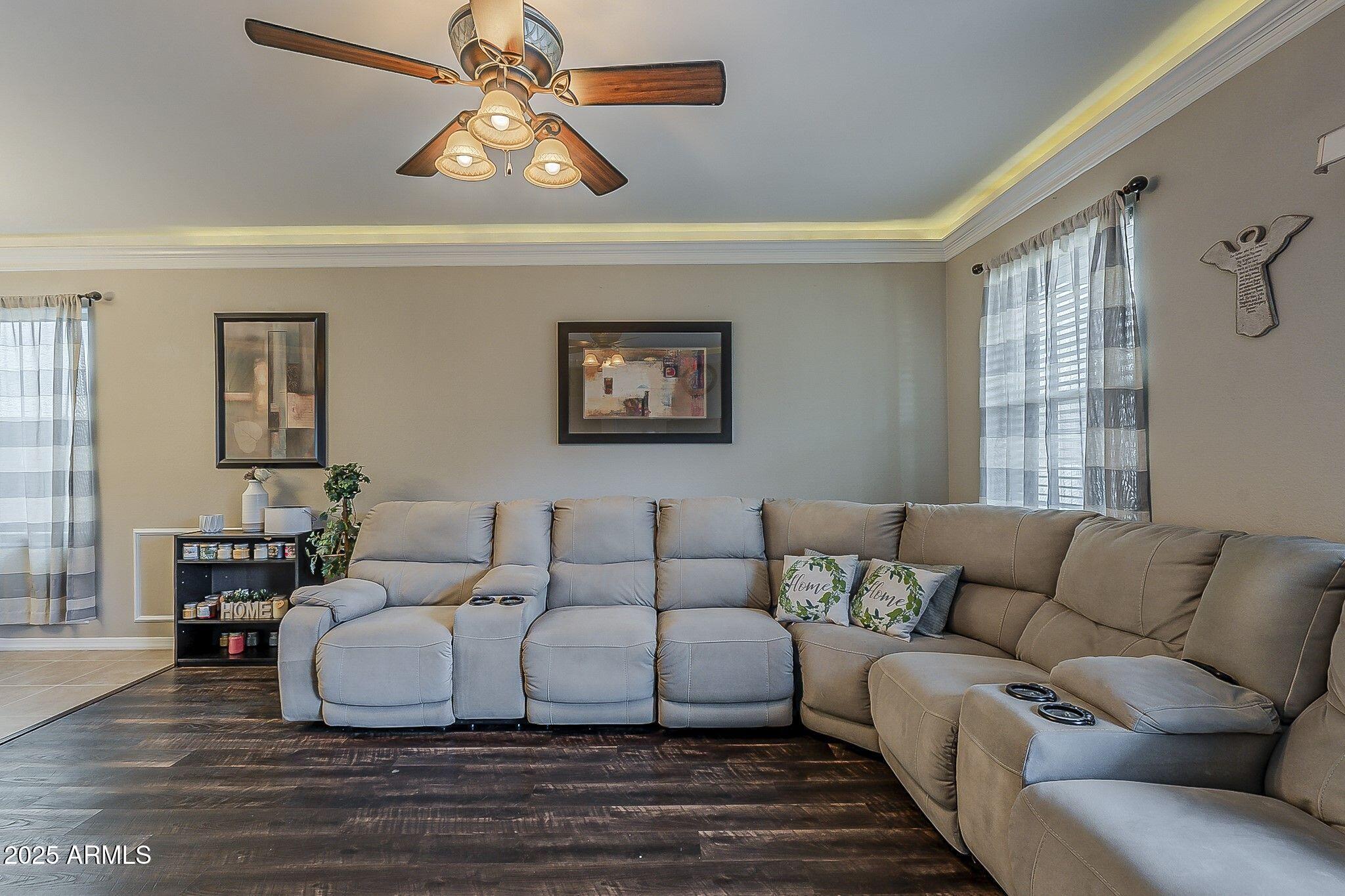 4407 West Crescent Road San Tan Valley, AZ 85144 - Photo 6 of 50 a living room with furniture a bed and a chandelier
