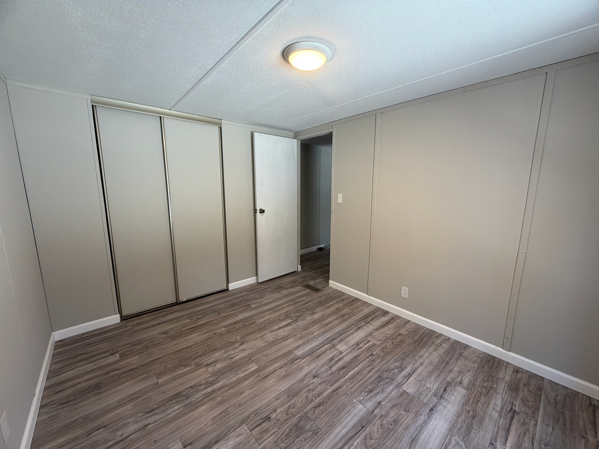 775 Slim Island Road Bowling Green, KY 42101 - Photo 13 of 17 a view of an empty room with wooden floor