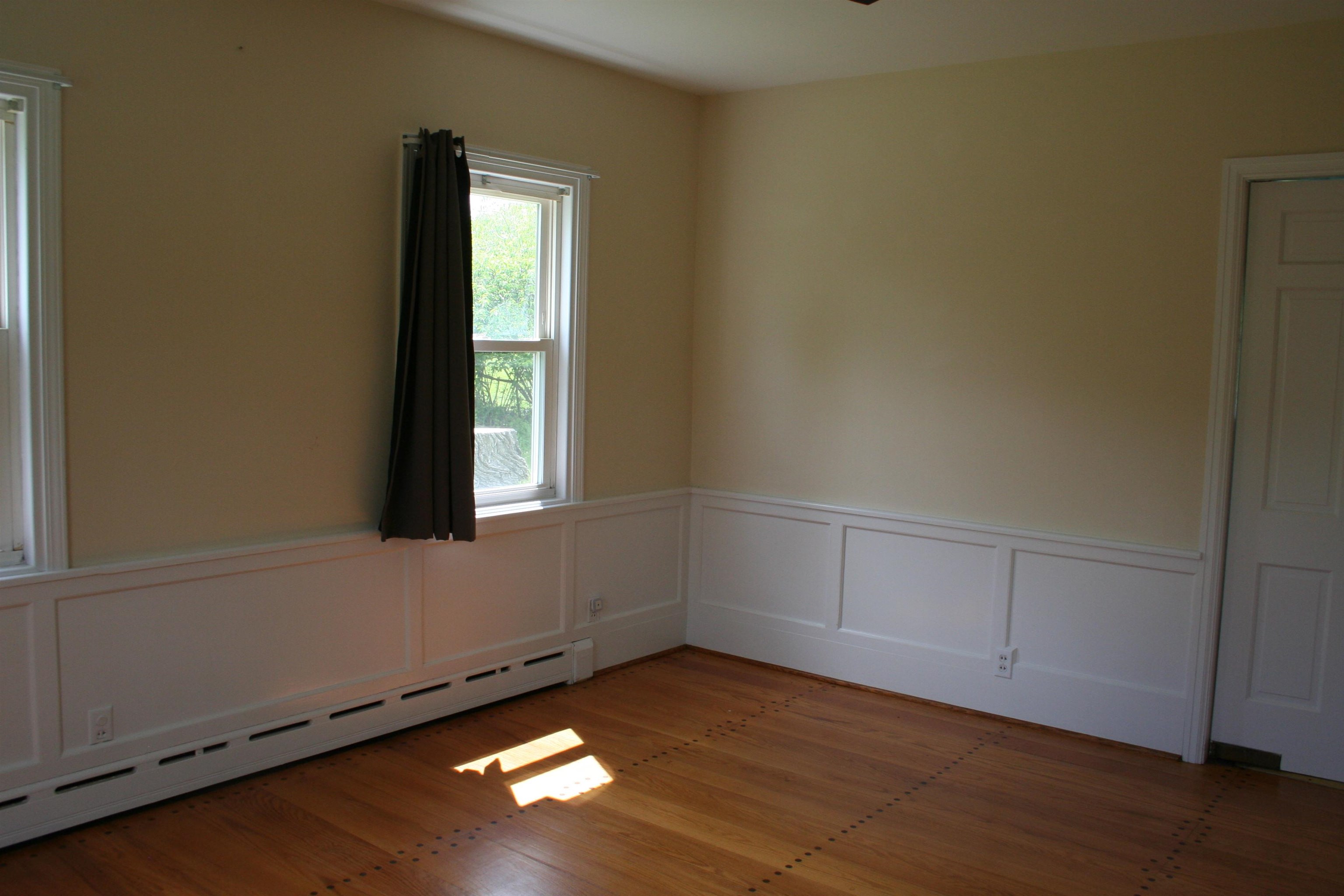 215 Potomac River Road Monterey, VA 24465 - Photo 14 of 43 an empty room with wooden floor and windows
