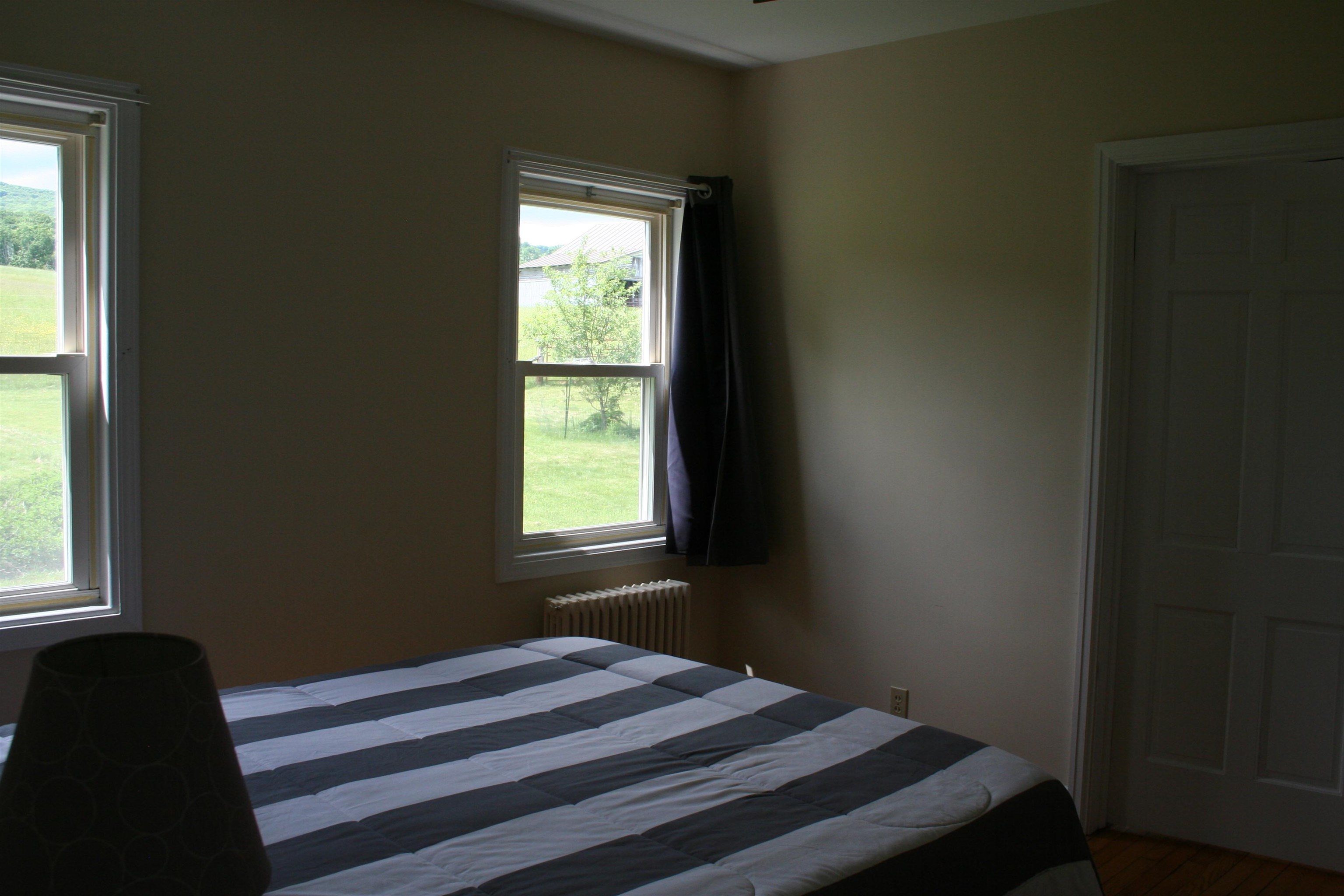 215 Potomac River Road Monterey, VA 24465 - Photo 15 of 43 a bedroom with a bed and a window