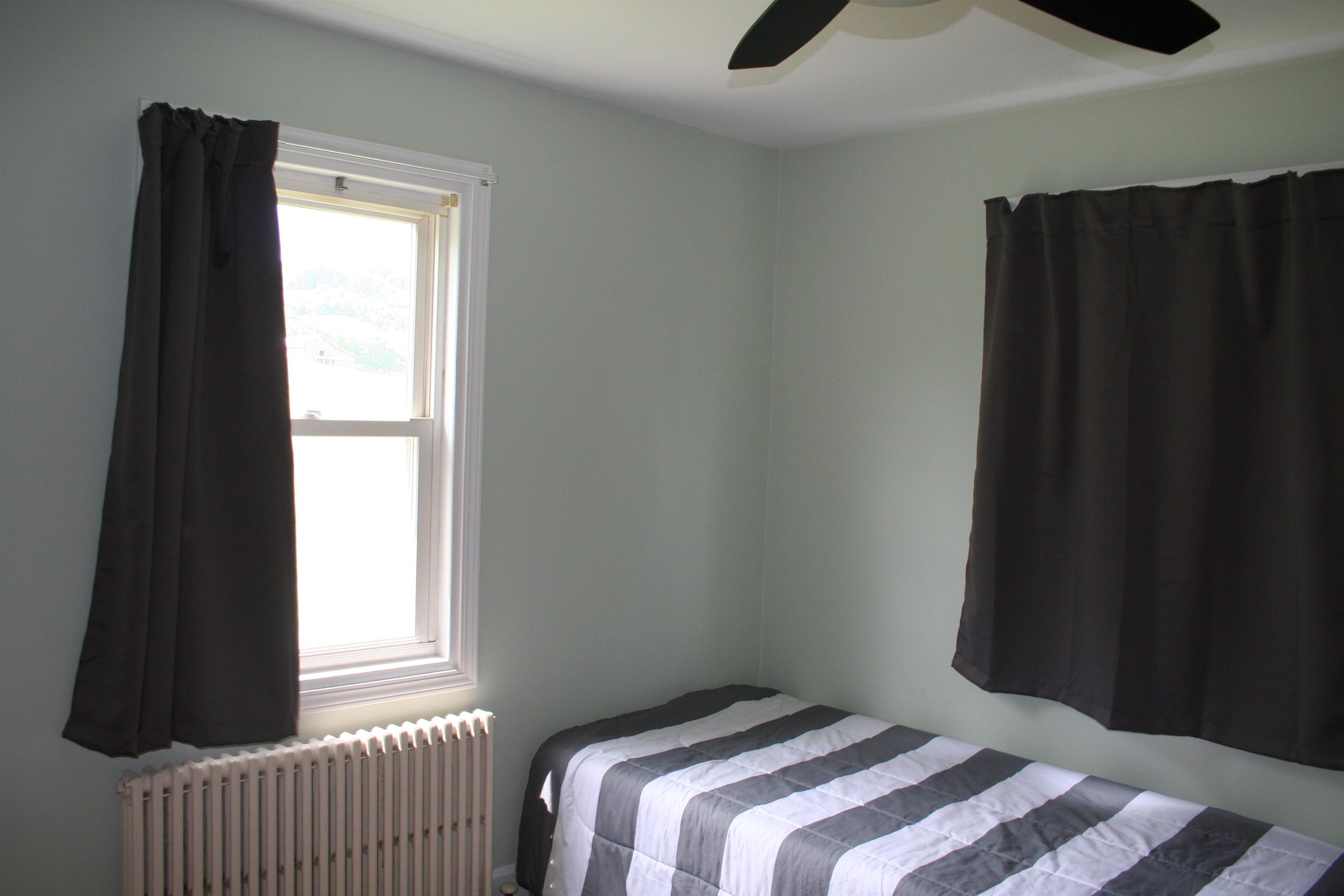 215 Potomac River Road Monterey, VA 24465 - Photo 23 of 43 a bedroom with a bed and a window