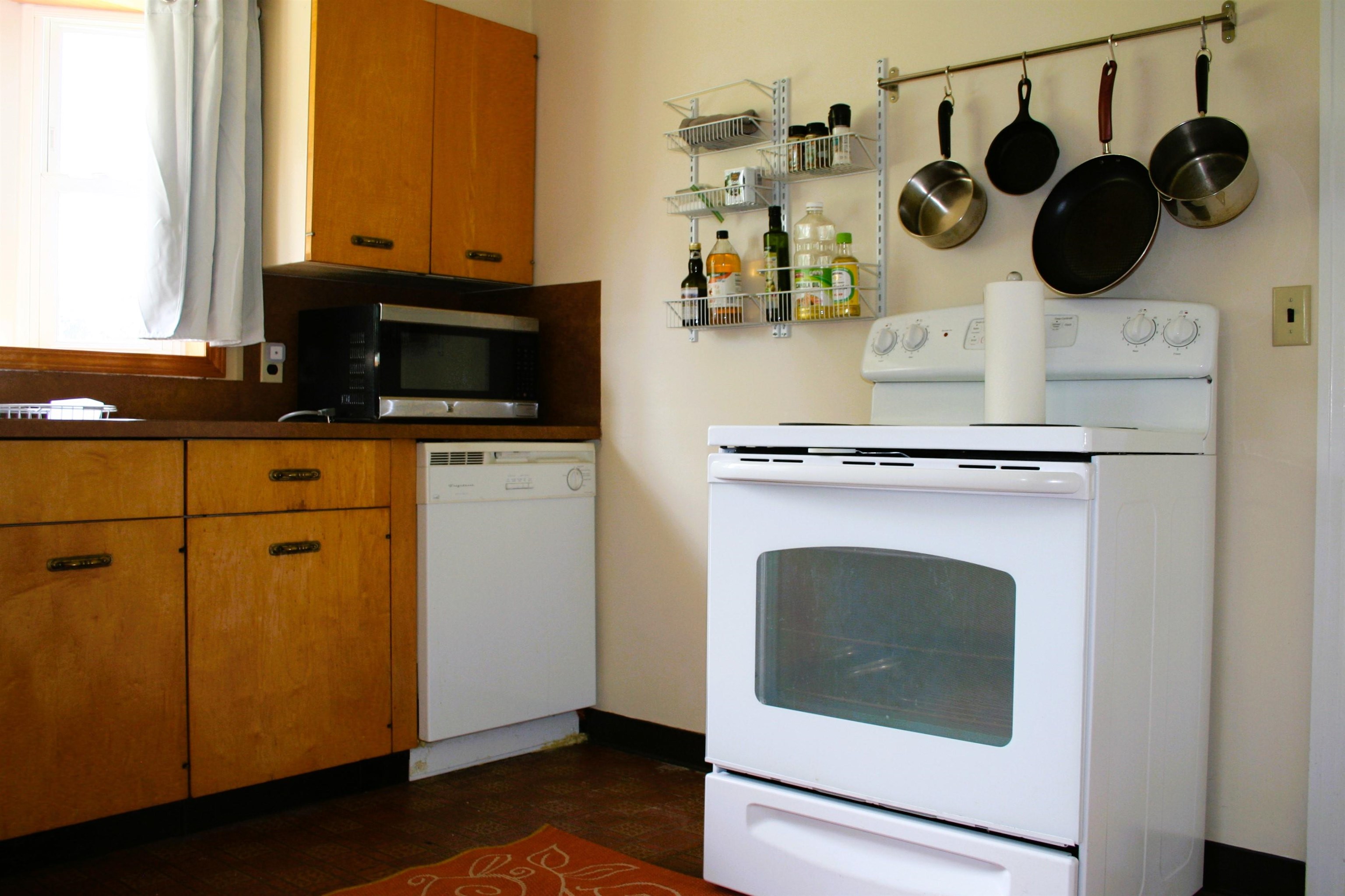 215 Potomac River Road Monterey, VA 24465 - Photo 10 of 43 a kitchen with a stove and a microwave