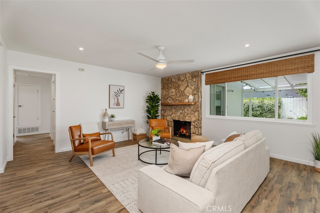 964 Lansing Lane Costa Mesa, CA 92626 - Photo 14 of 29 a living room with furniture and a fireplace