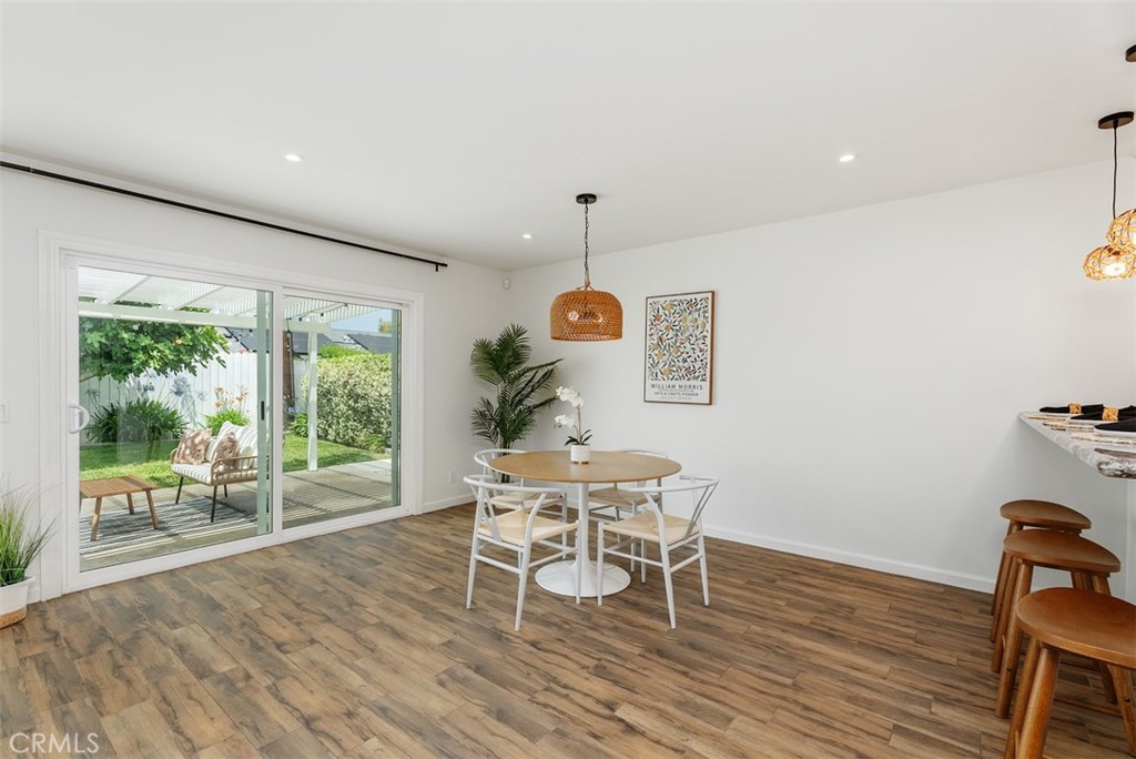 964 Lansing Lane Costa Mesa, CA 92626 - Photo 15 of 29 a view of a dining room with furniture window and wooden floor
