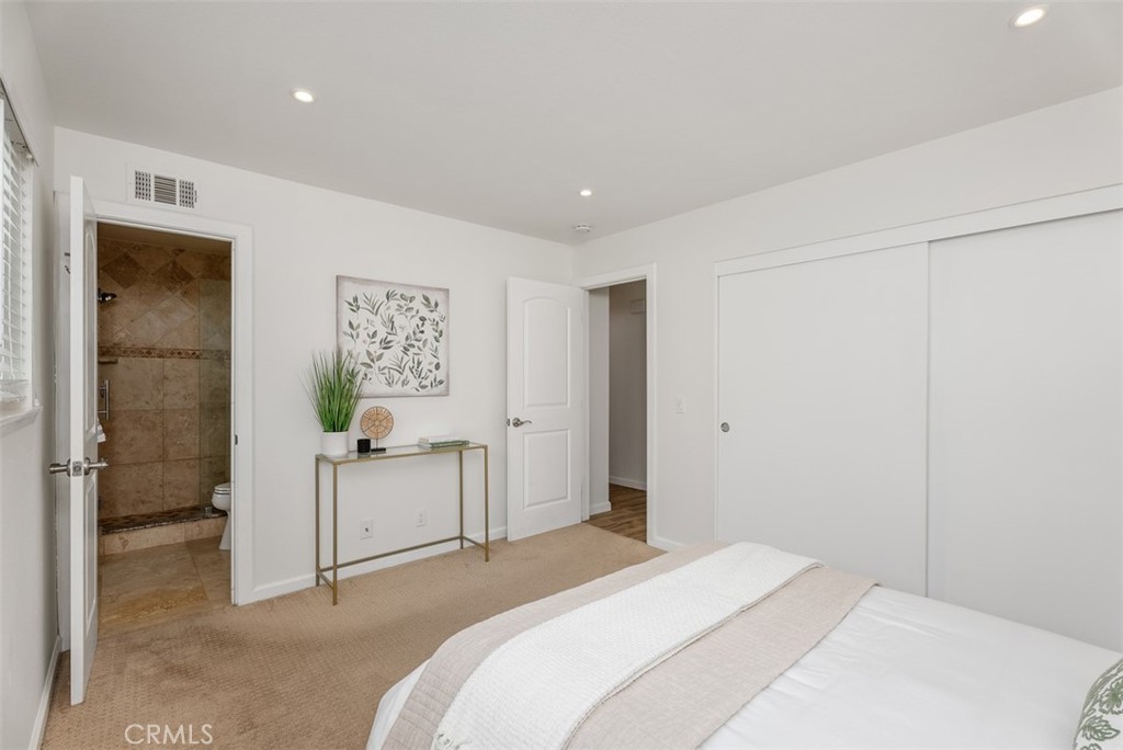 964 Lansing Lane Costa Mesa, CA 92626 - Photo 20 of 29 a spacious bedroom with a bed and a shower