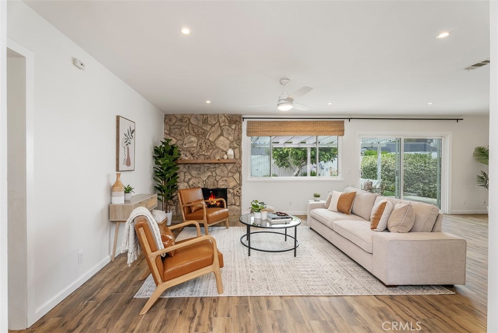 964 Lansing Lane Costa Mesa, CA 92626 - Photo 3 of 29 a living room with furniture and a fireplace