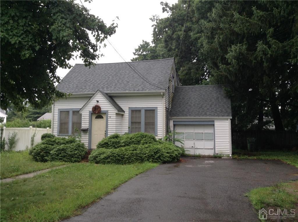 78 Vineyard Road Edison, NJ 08817 - Photo 1 of 4 a front view of a house with a yard and garage