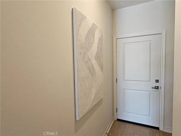 a bathroom with a granite countertop toilet and a sink