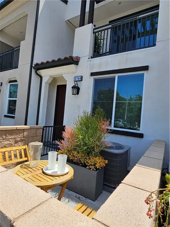 a bedroom with a bed and a lamp