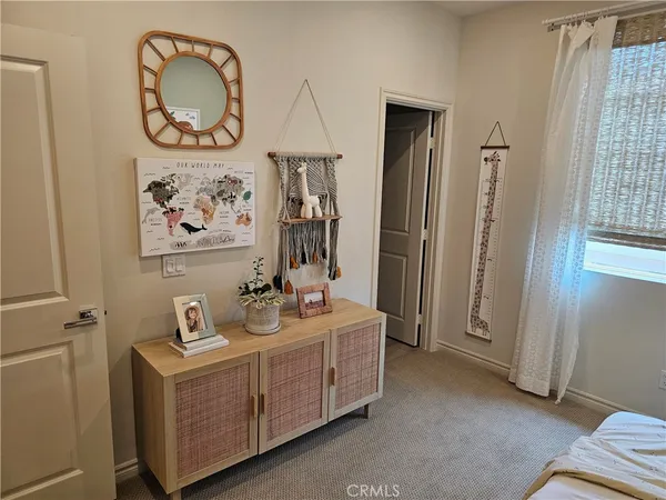 a bedroom with a bed furniture and a window