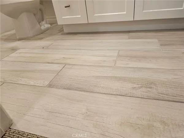 a bathroom with a shower and a glass door