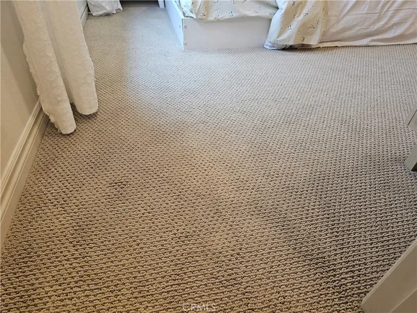 a bathroom with a glass door shower a toilet and a sink