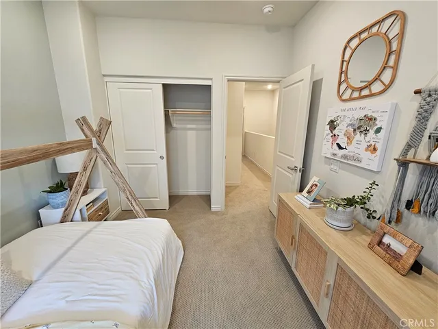 a view of a hallway with wooden floor and entryway