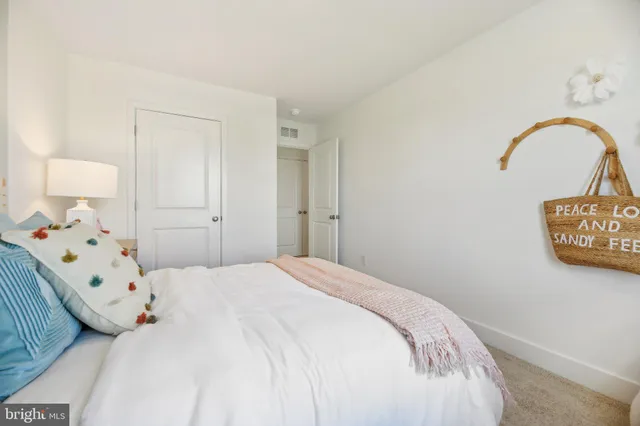 a bedroom with a bed and a area