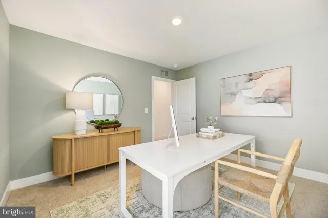 a kitchen with a stove a table and chairs in it