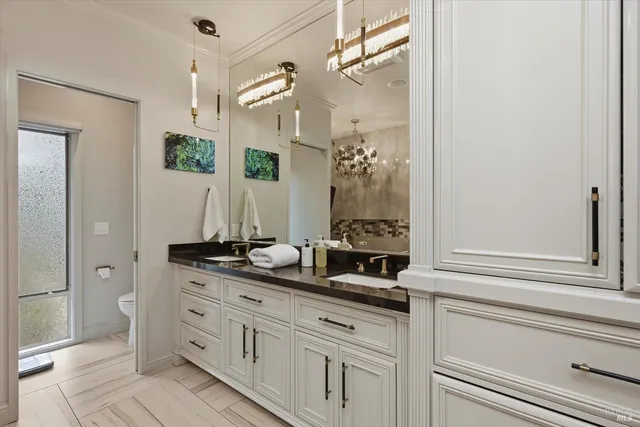 a kitchen with a refrigerator and a stove top oven