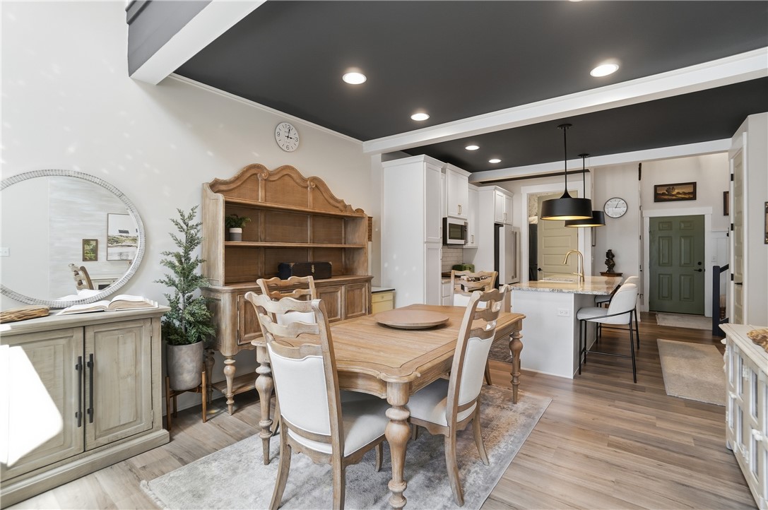 605 Cape Cod Court Beavercreek, OH 45430 - Photo 17 of 54 This inviting dining area seamlessly connects to a modern kitchen, creating an open and functional living space.