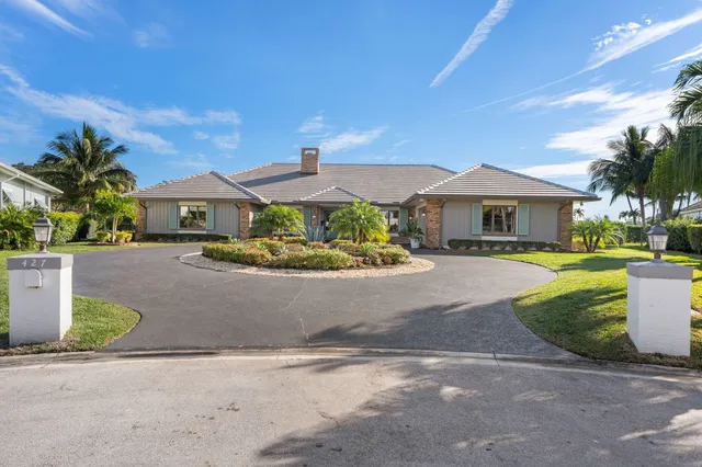 a house view with a backyard space