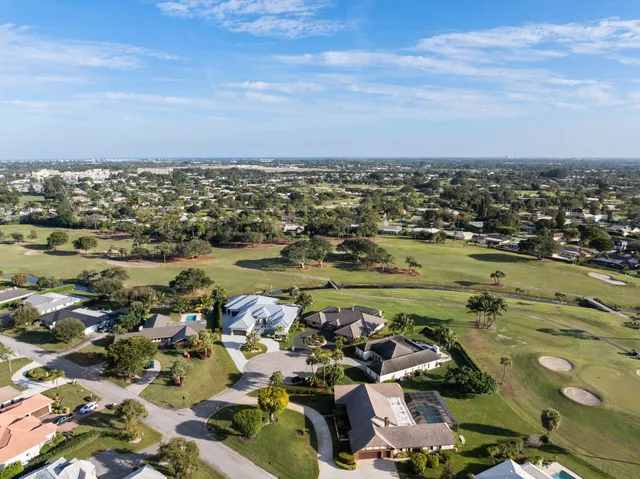a lobby with furniture and floor to ceiling window