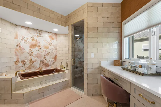 a bathroom with a granite countertop sink a toilet and shower