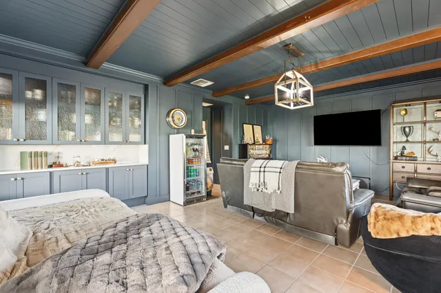 a bedroom with a bed and a television