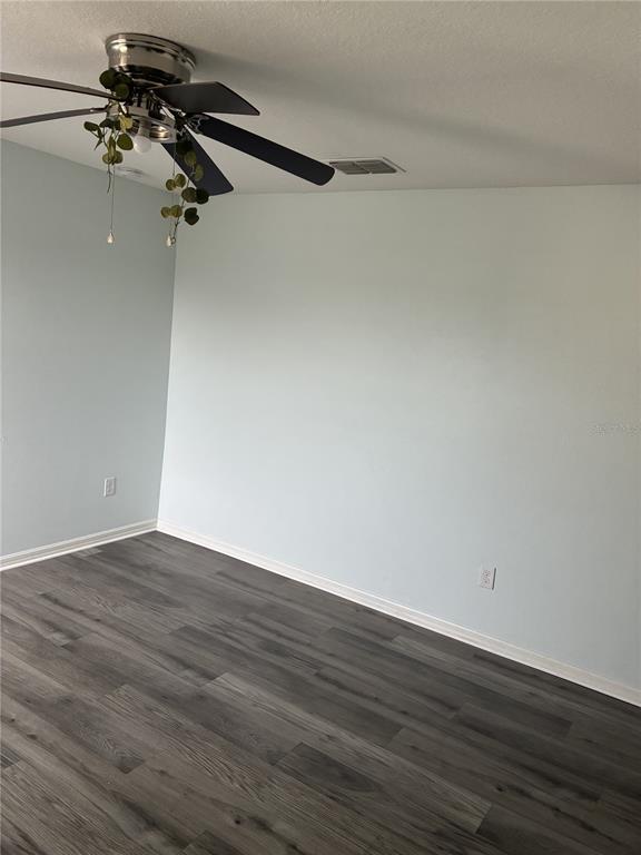9616 Lemon Drop Loop Sun City Center, FL 33573 - Photo 32 of 53 a view of a room with wooden floor
