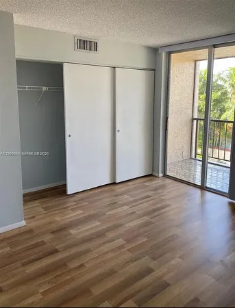 a view of a livingroom with wooden floor