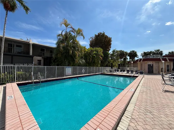 a view of a balcony with swimming pool