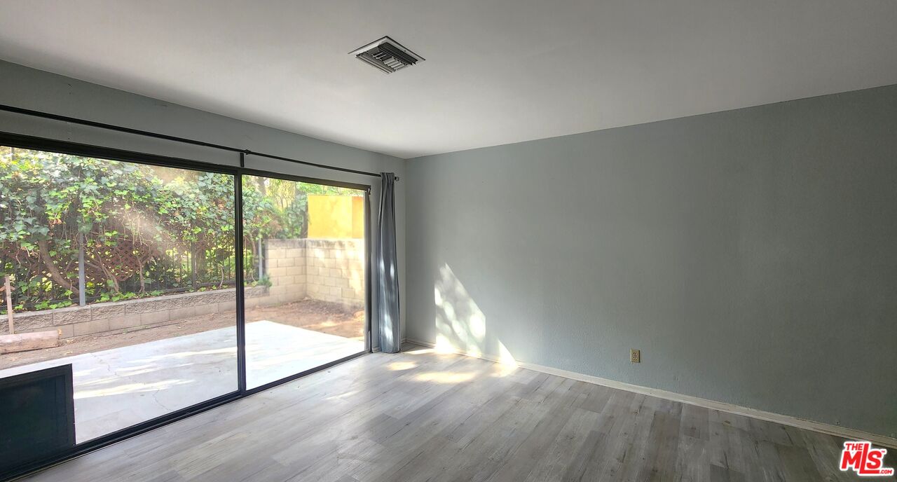 5227 Eagle Dale Avenue Los Angeles, CA 90041 - Photo 7 of 10 a view of empty room with wooden floor and fan