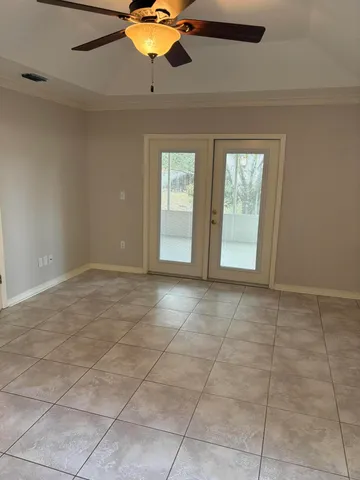 a view of an empty room with a window