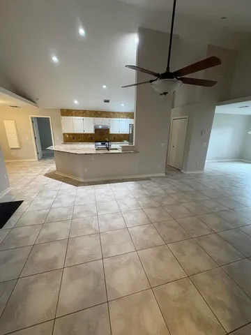 a view of a refrigerator in a kitchen