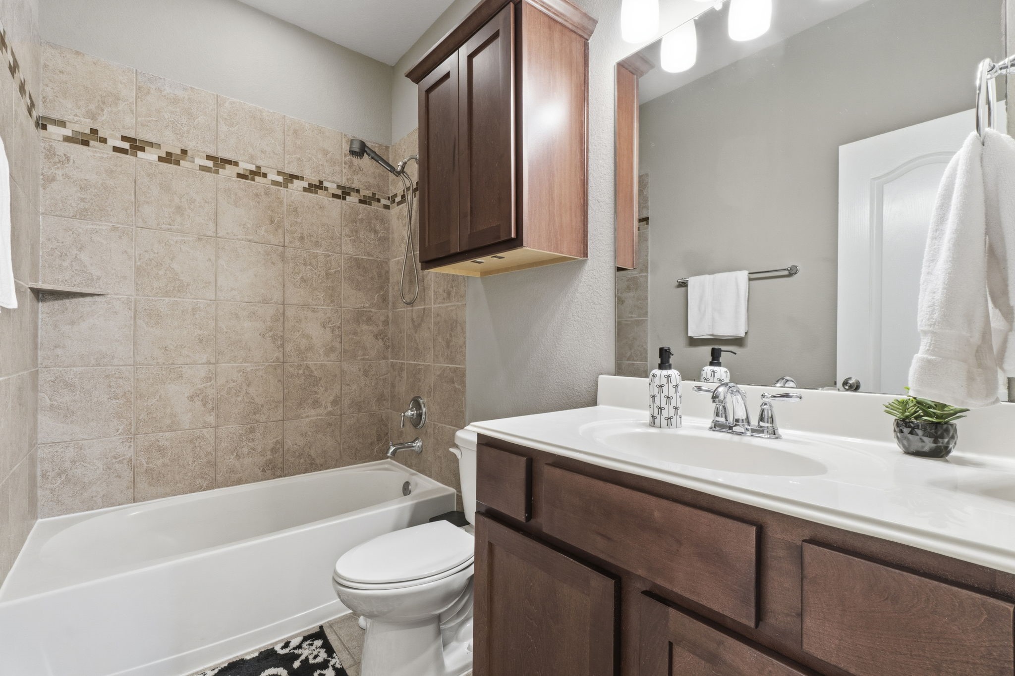 3900 Enchanted Timbers Lane Spring, TX 77386 - Photo 30 of 49 a bathroom with a sink a toilet and shower