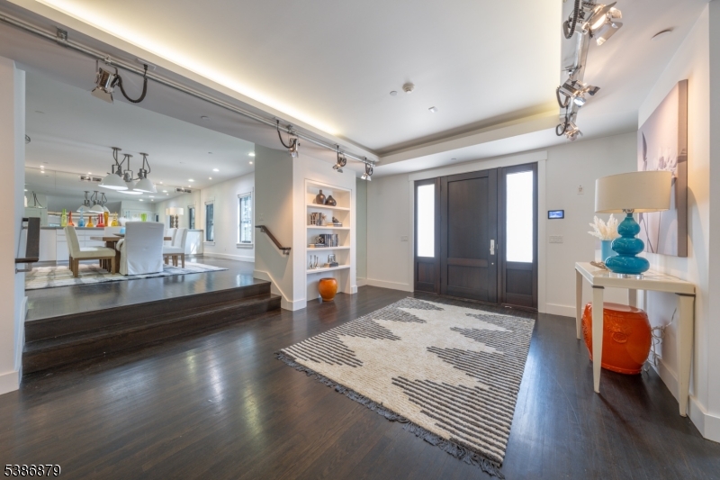 60 Fernwood Road Summit, NJ 07901 - Photo 11 of 50 a living room with kitchen island granite countertop furniture and a wooden floor