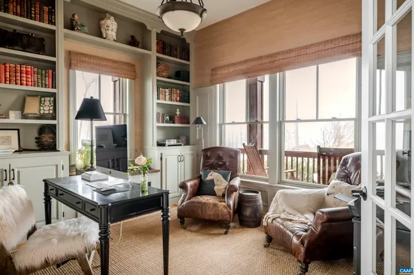 a spacious bathroom with a tub sink and mirror