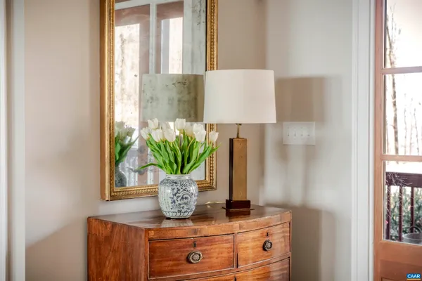 a view of kitchen with dining table chairs and wooden floor