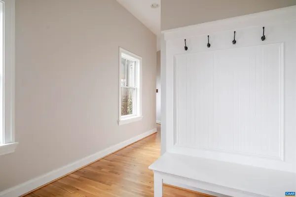 a spacious bedroom with a bed and a window