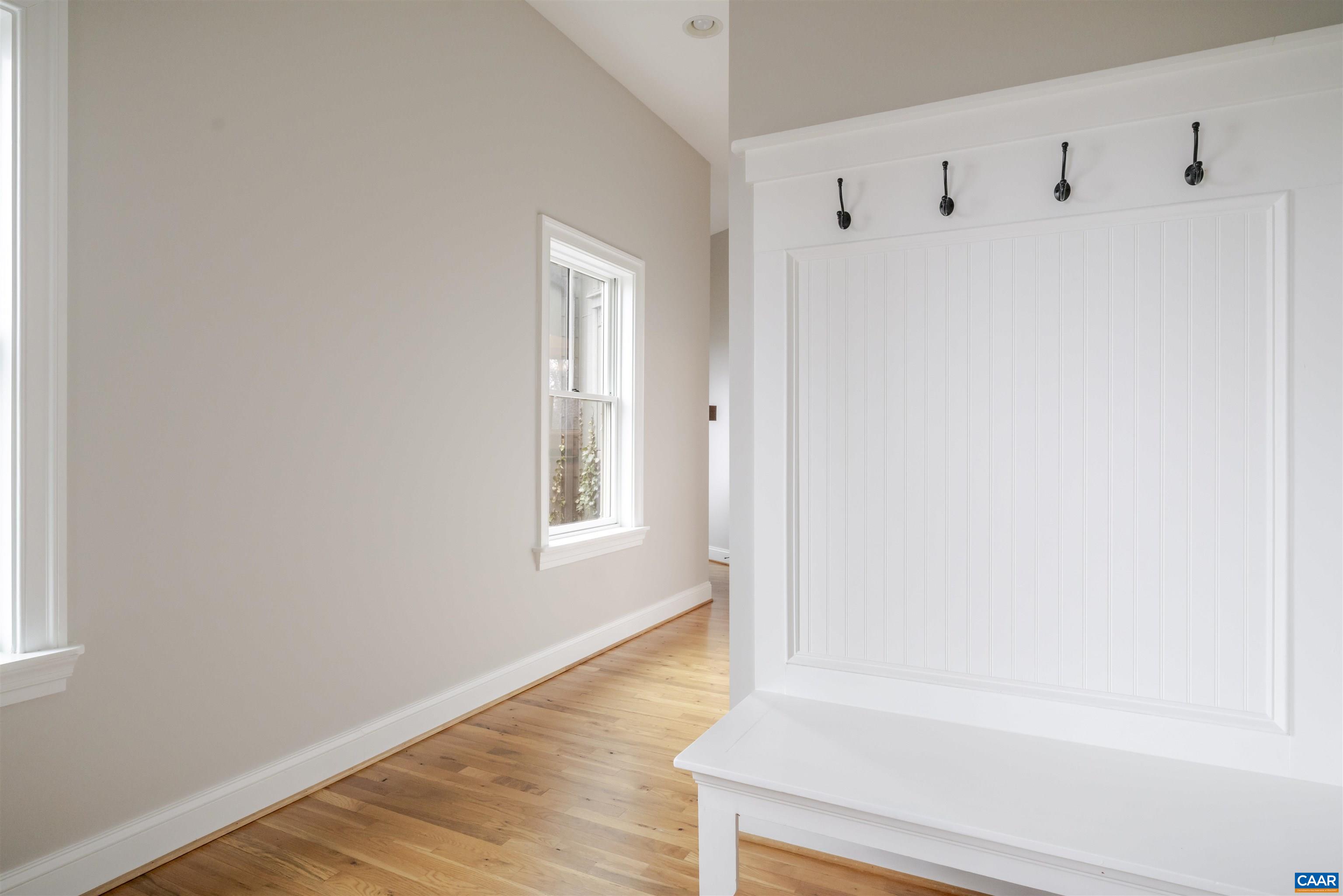 765 Summit Ridge Point Charlottesville, VA 22911 - Photo 22 of 60 a view of an empty room with wooden floor and a window