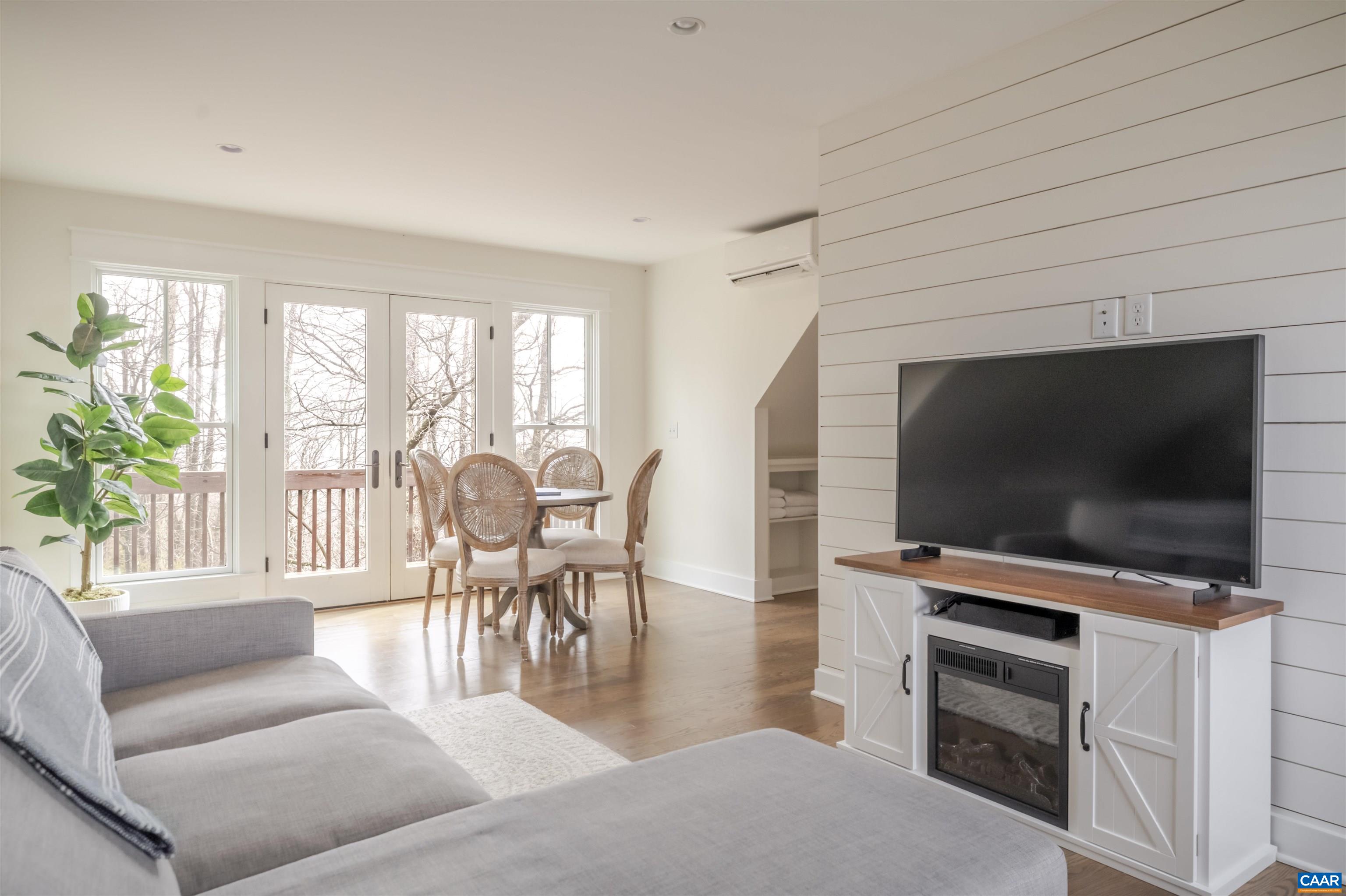 765 Summit Ridge Point Charlottesville, VA 22911 - Photo 29 of 60 a living room with furniture and a flat screen tv