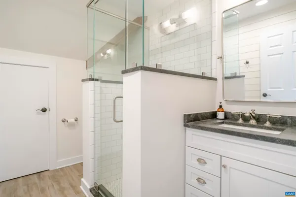 a bathroom with sink and mirror