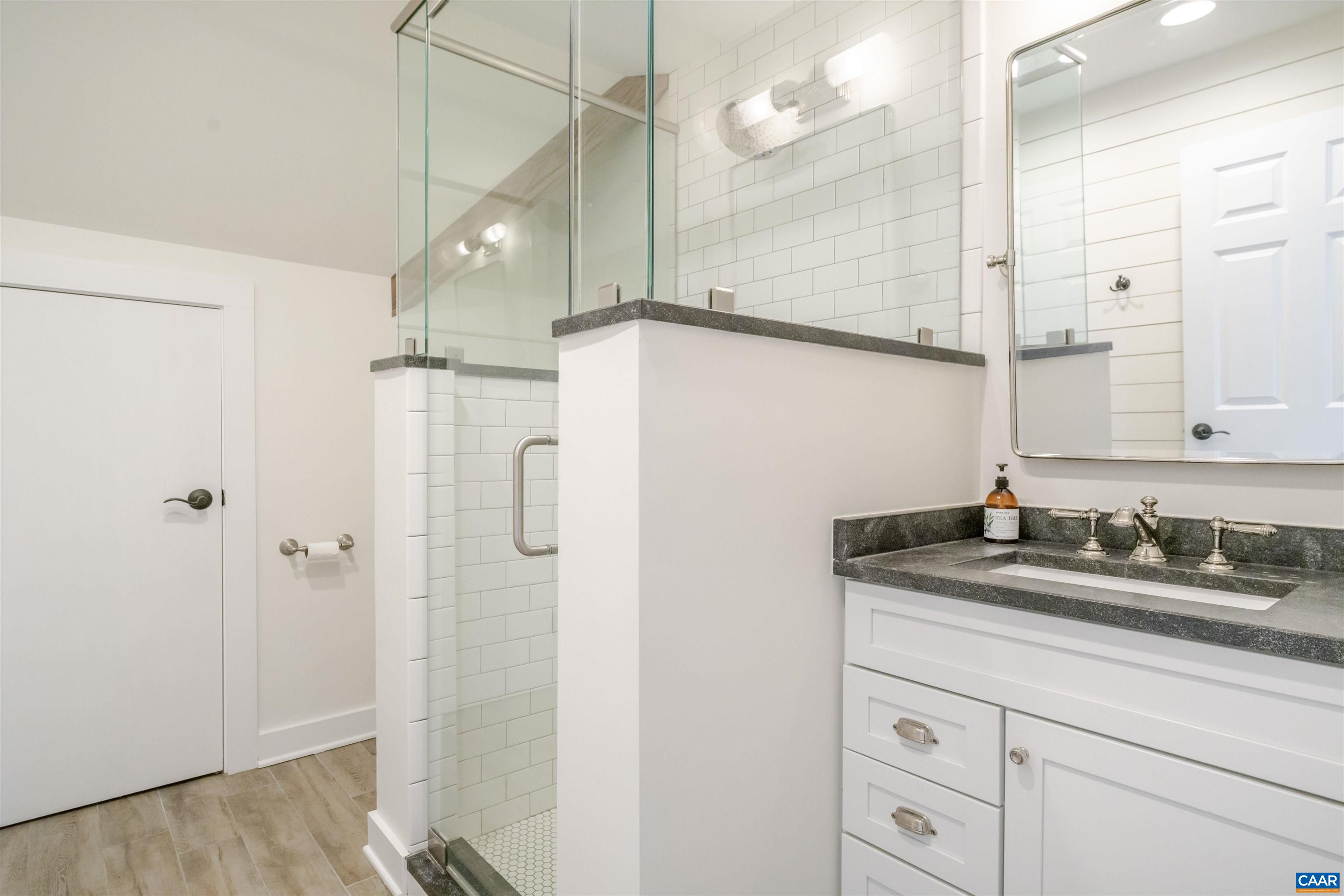 765 Summit Ridge Point Charlottesville, VA 22911 - Photo 30 of 60 a bathroom with a sink and a mirror