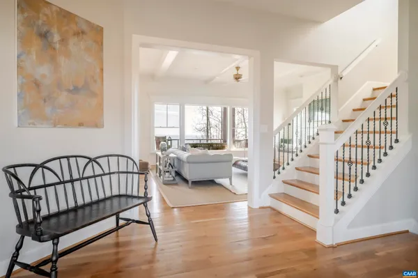 a view of a dining room with furniture wooden floor and chandelier