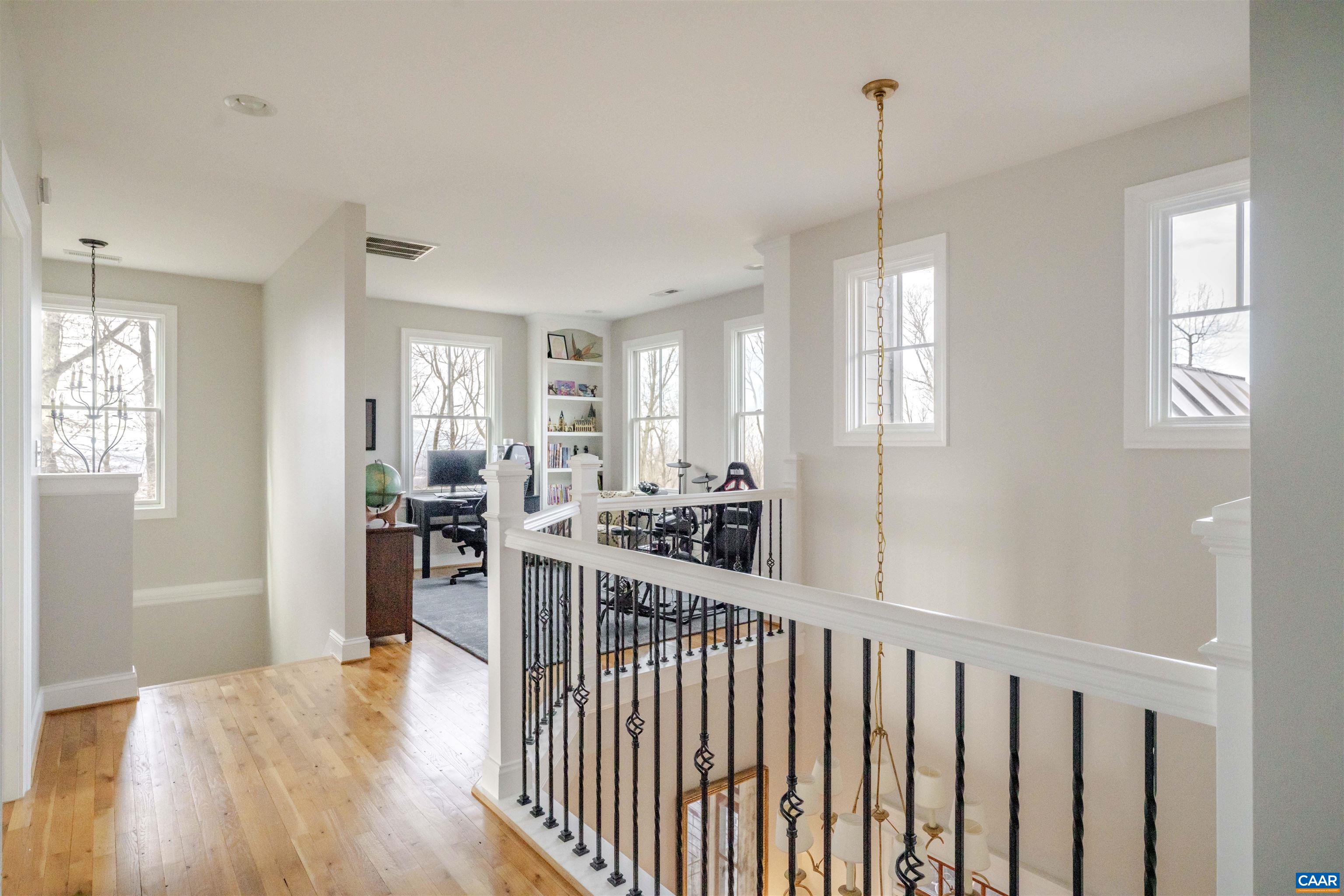 765 Summit Ridge Point Charlottesville, VA 22911 - Photo 31 of 60 a view of a kitchen with kitchen island wooden floor center island and stainless steel appliances
